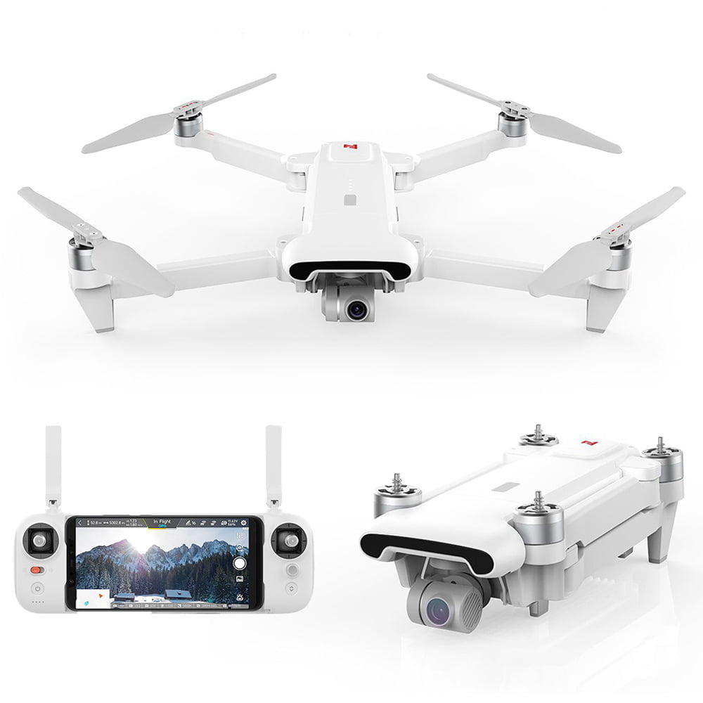 Drone, drone plegado y control blancos